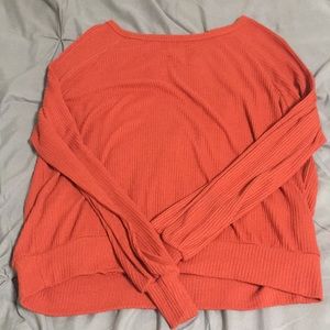 A orange long sleeve